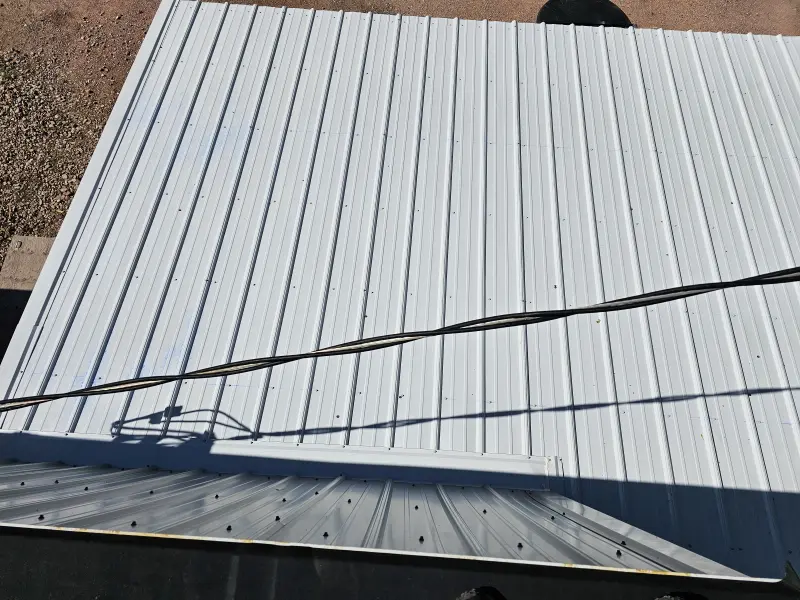 Metal roof panels being installed by the Keystone crew